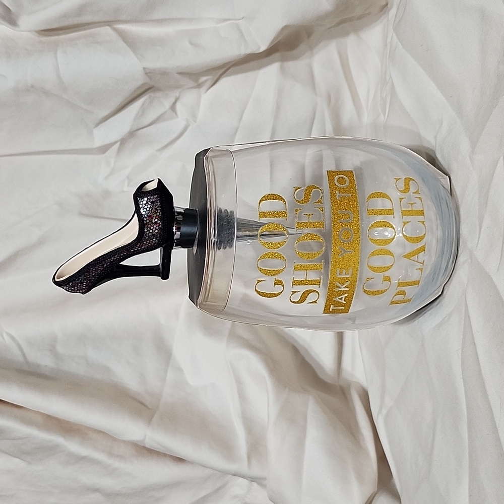 Wine glass with bottle shaped like a shoe